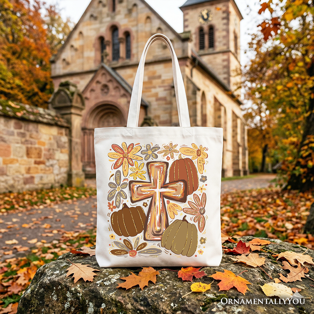 Cream tote bag with gold cross and fall floral pumpkin illustration