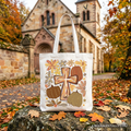 Cream tote bag with gold cross and fall floral pumpkin illustration