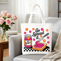 White tote bag with beige handles and colorful 'Go Spread It' religious print