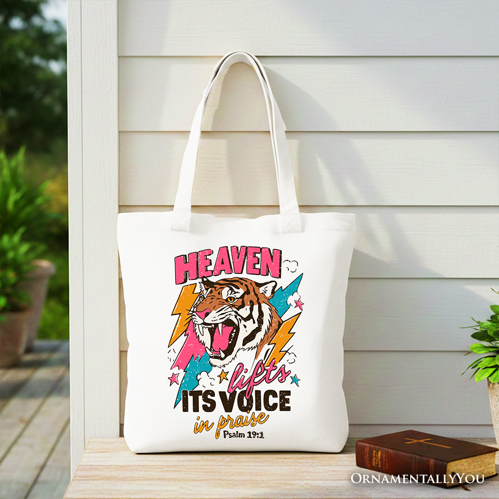 White tote bag with tiger face graphic and “Heaven” headline on the front.
