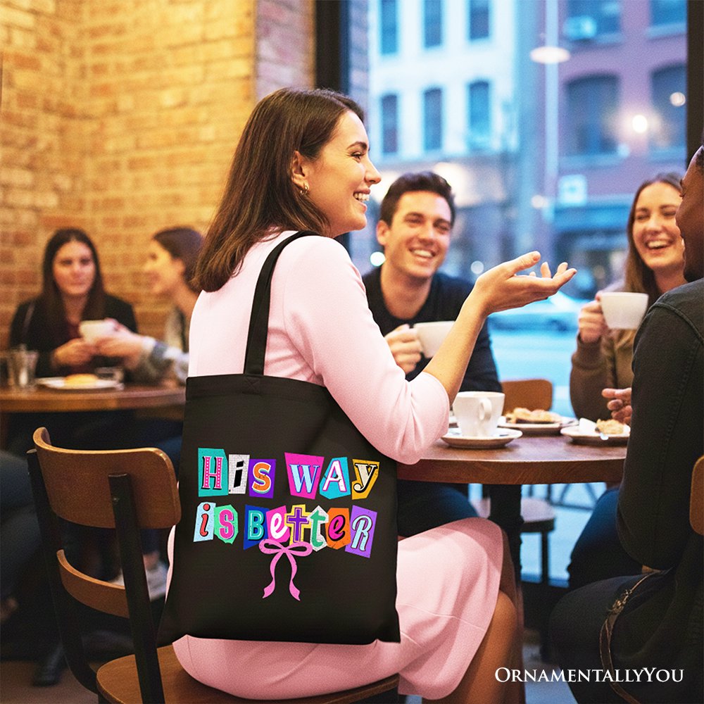 Black canvas tote bag with colorful 'His Way is Better' print, side view