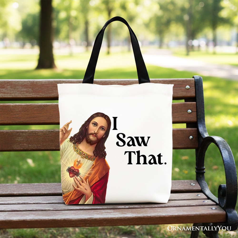 Canvas tote bag with black handles, Jesus print and “I Saw That.” text.