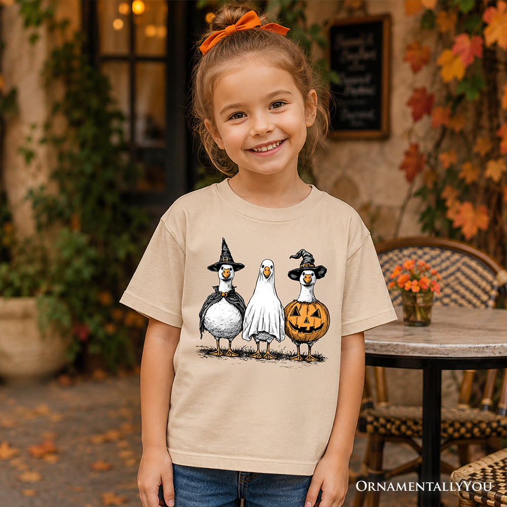 Kids sand Halloween T-shirt with penguin trio graphic and glowing jack-o-lantern