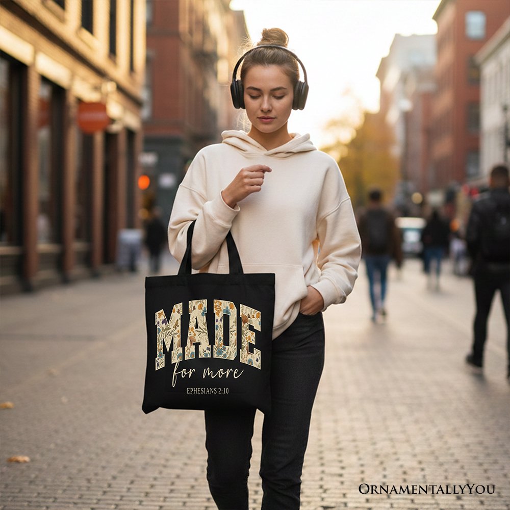 Black canvas tote bag with MADE for more floral design and Ephesians 2:10 text