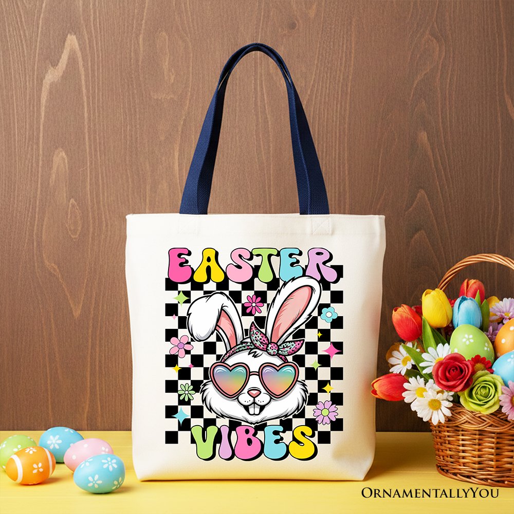 White tote bag with navy handles and 'Easter Vibes' bunny graphic.