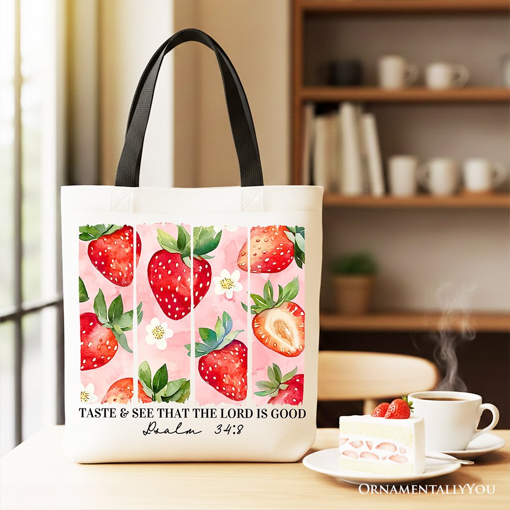 Strawberry print canvas tote bag with black handles and white front panel
