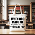 White tote bag with long handles and “WHEN GOD MADE ME” front print.
