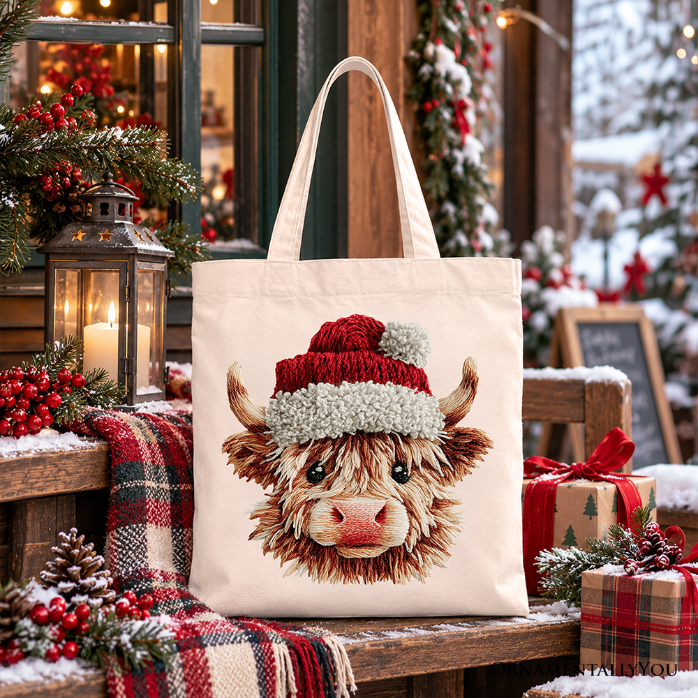 Cream canvas tote bag featuring Highland cow face in Santa hat
