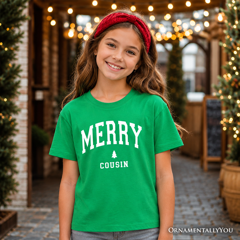 Kids green Christmas T-shirt with white 'MERRY COUSIN' text and tree graphic