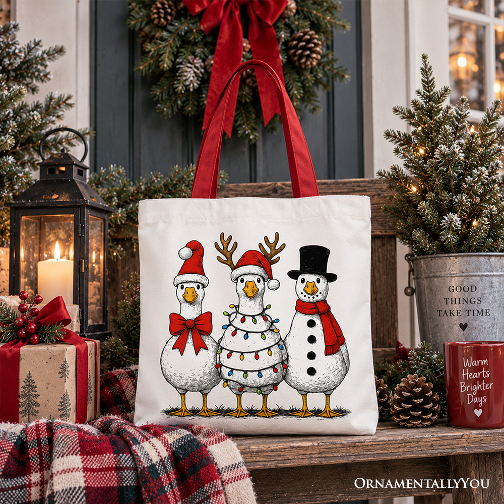 Holiday tote bag featuring three cartoon snowmen wearing red scarves and black top hats