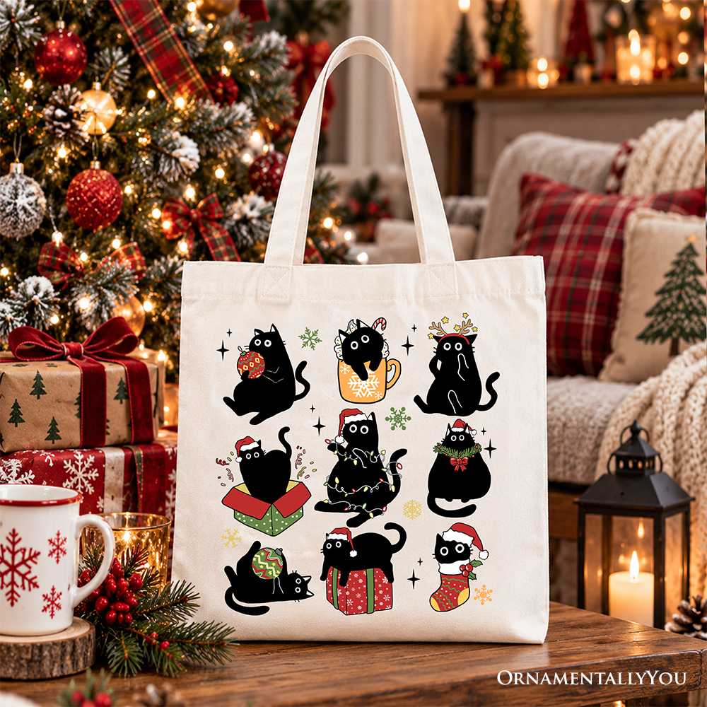 White tote bag featuring a grid of black cats wearing Santa hats and holiday outfits