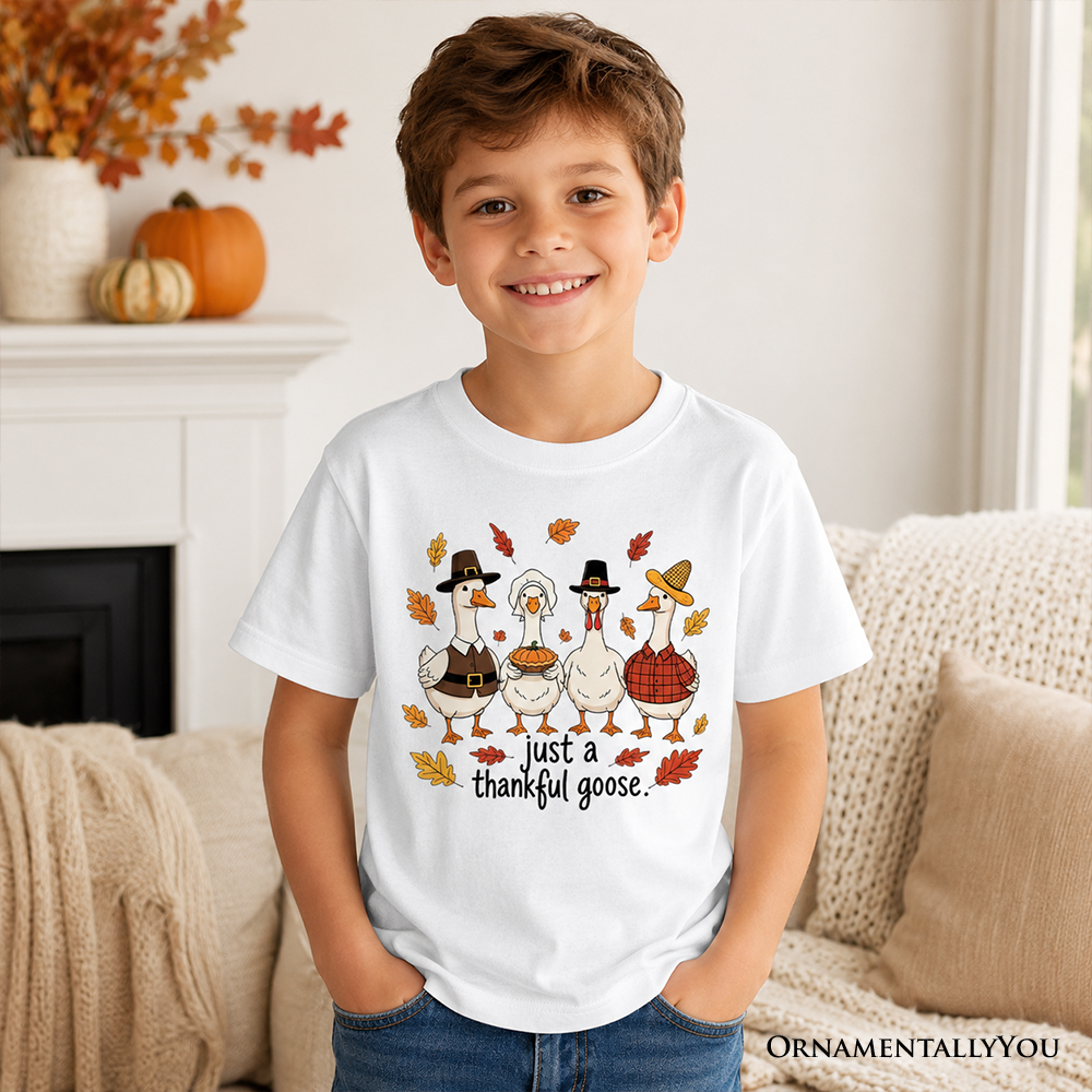 Kids white T-shirt with cartoon turkey family graphic and “just a thankful goose”
