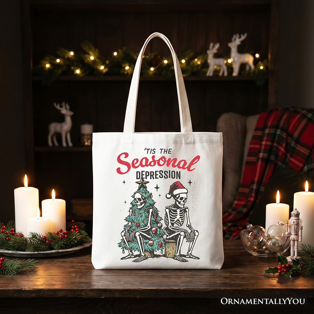 White cotton tote bag with 'Tis the Seasonal Depression' print, featuring skeleton and tree