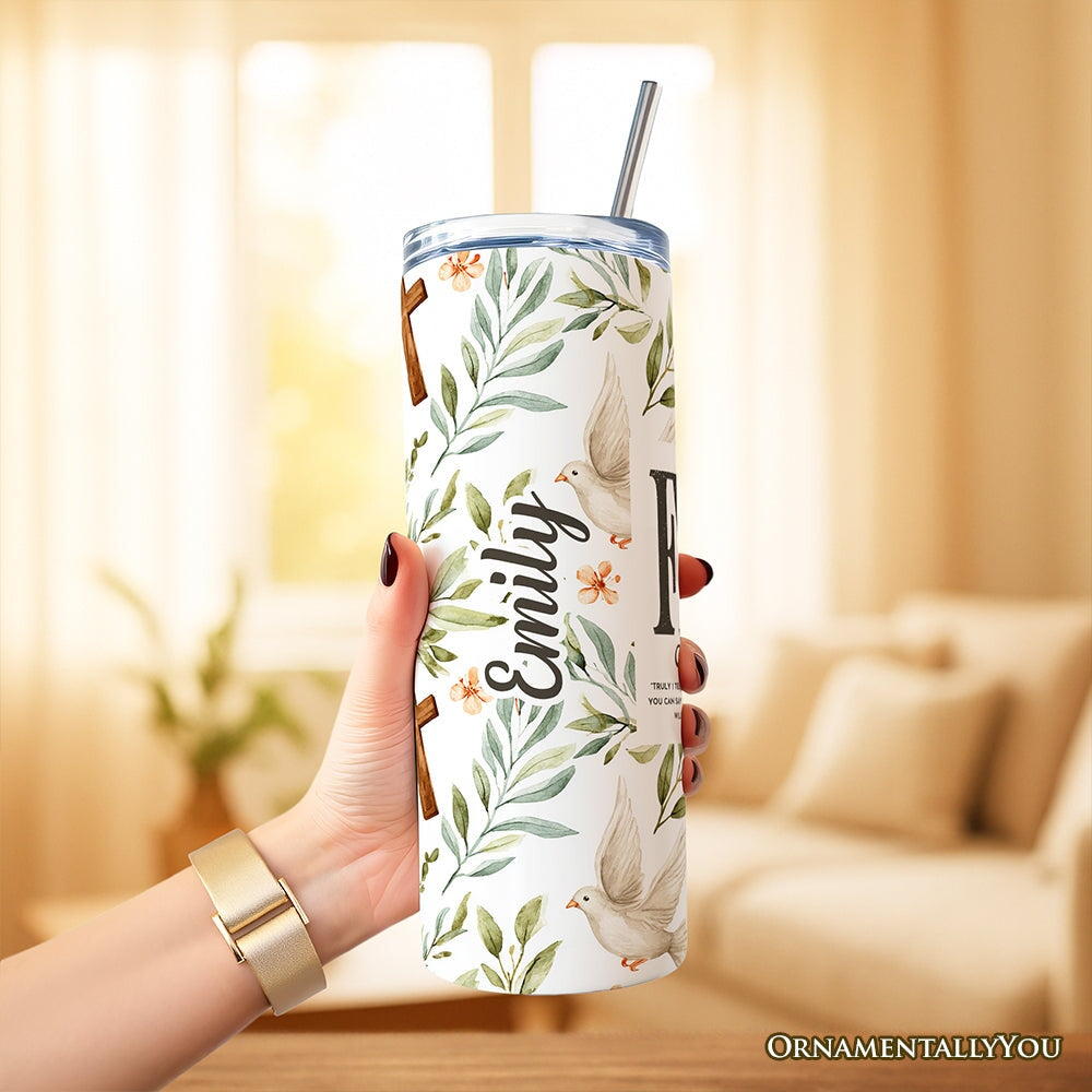 Faith tumbler held up with lid and stainless straw; leaf, dove, and cross floral print