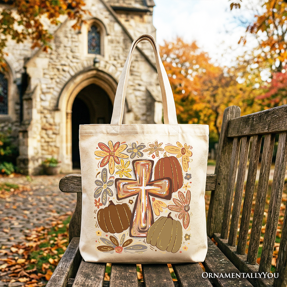 Cream tote bag with gold cross and pumpkins on front panel