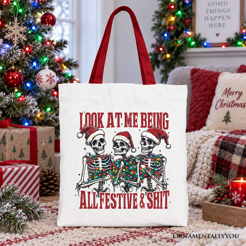 White cotton tote bag with skeleton holiday graphic and red text; red handles