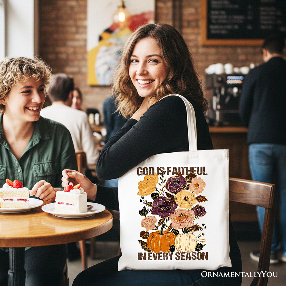 White cotton tote bag with floral bouquet and 'God is faithful in every season' lettering