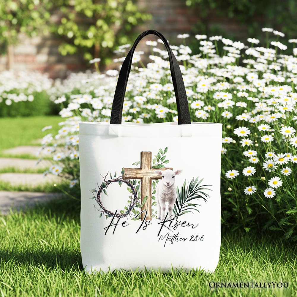 White tote bag with cross, lamb, and Matthew 28:6 verse print, dark handle