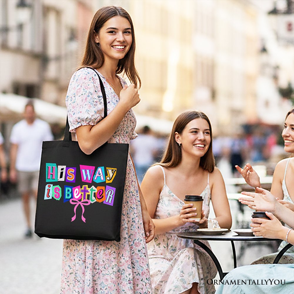Black canvas tote bag with colorful 'His Way is Better' graphic, handcarried
