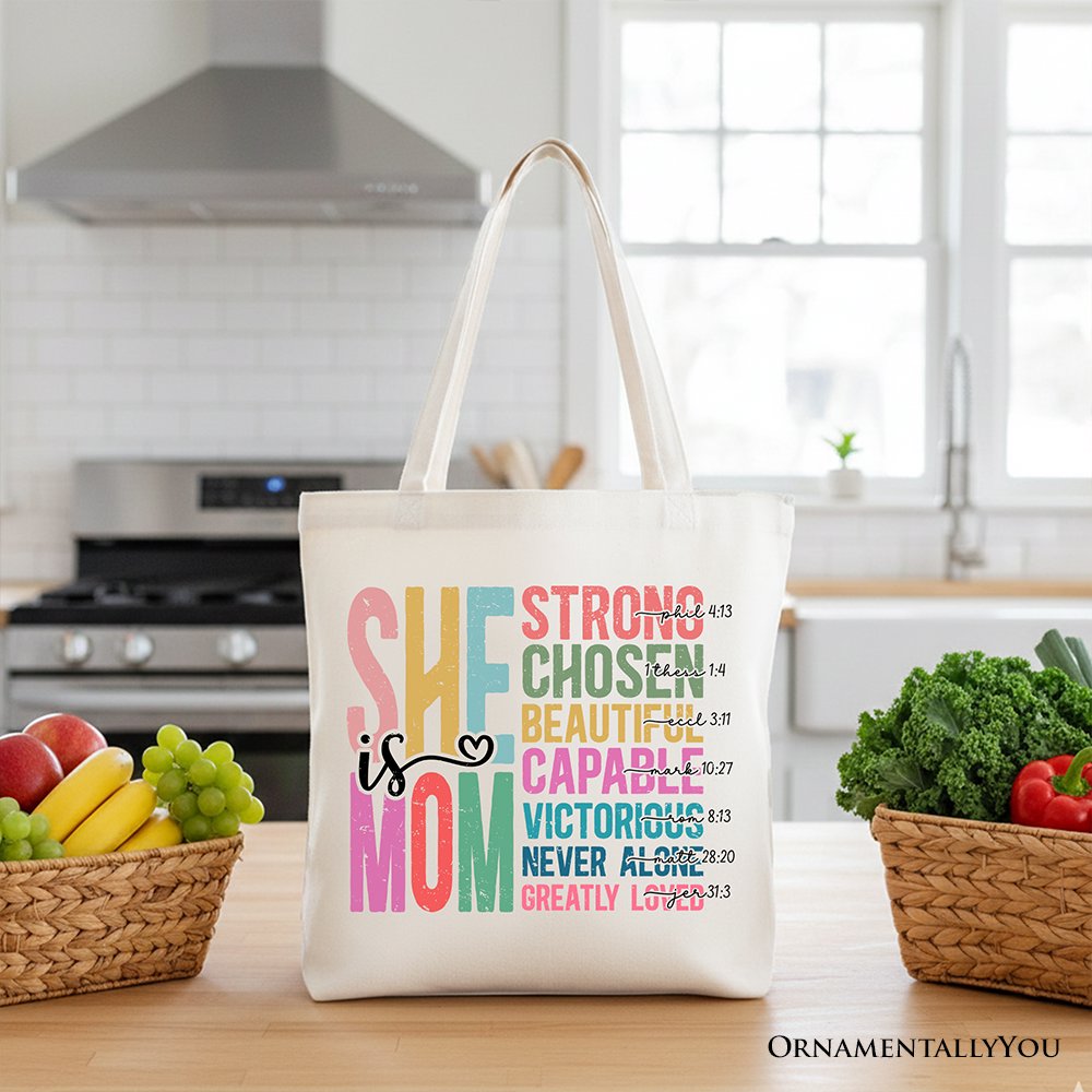 White canvas tote bag with light handles and colorful motivational quote print