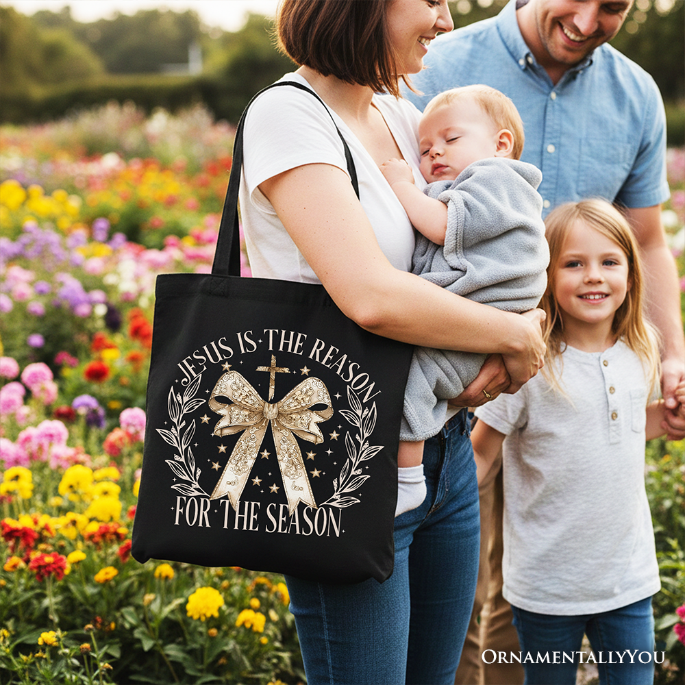 Black Christmas tote bag with gold bow and floral lettering, two top handles