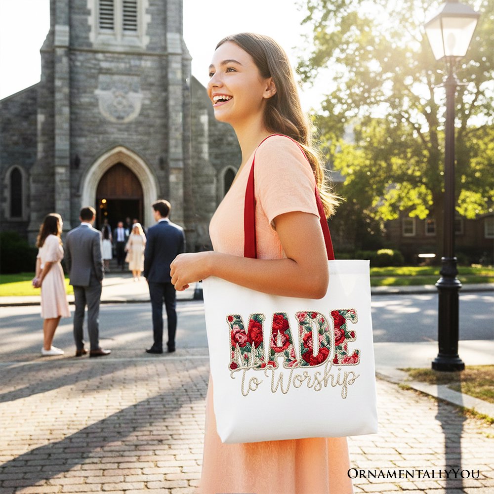 White tote bag with red handles and floral “MADE to Worship” print