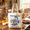 White Thanksgiving tote bag with light tan handles and front turkey graphic and caption.