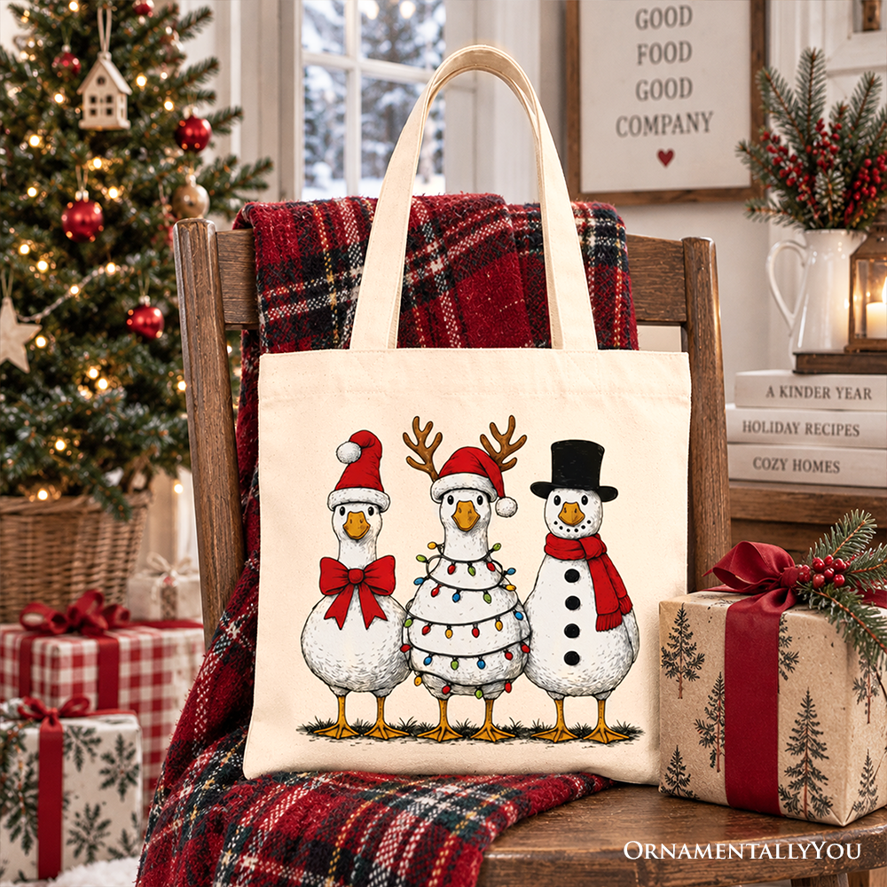 Winter tote bag with three cartoon snowmen illustration in red and black, cream handles