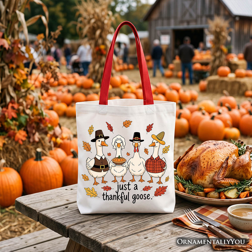 White tote bag with red handles, Thanksgiving turkey family graphic and 'just a thankful goose'