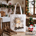 White tote bag featuring Santa with leopard accents and “Believe” lettering on front