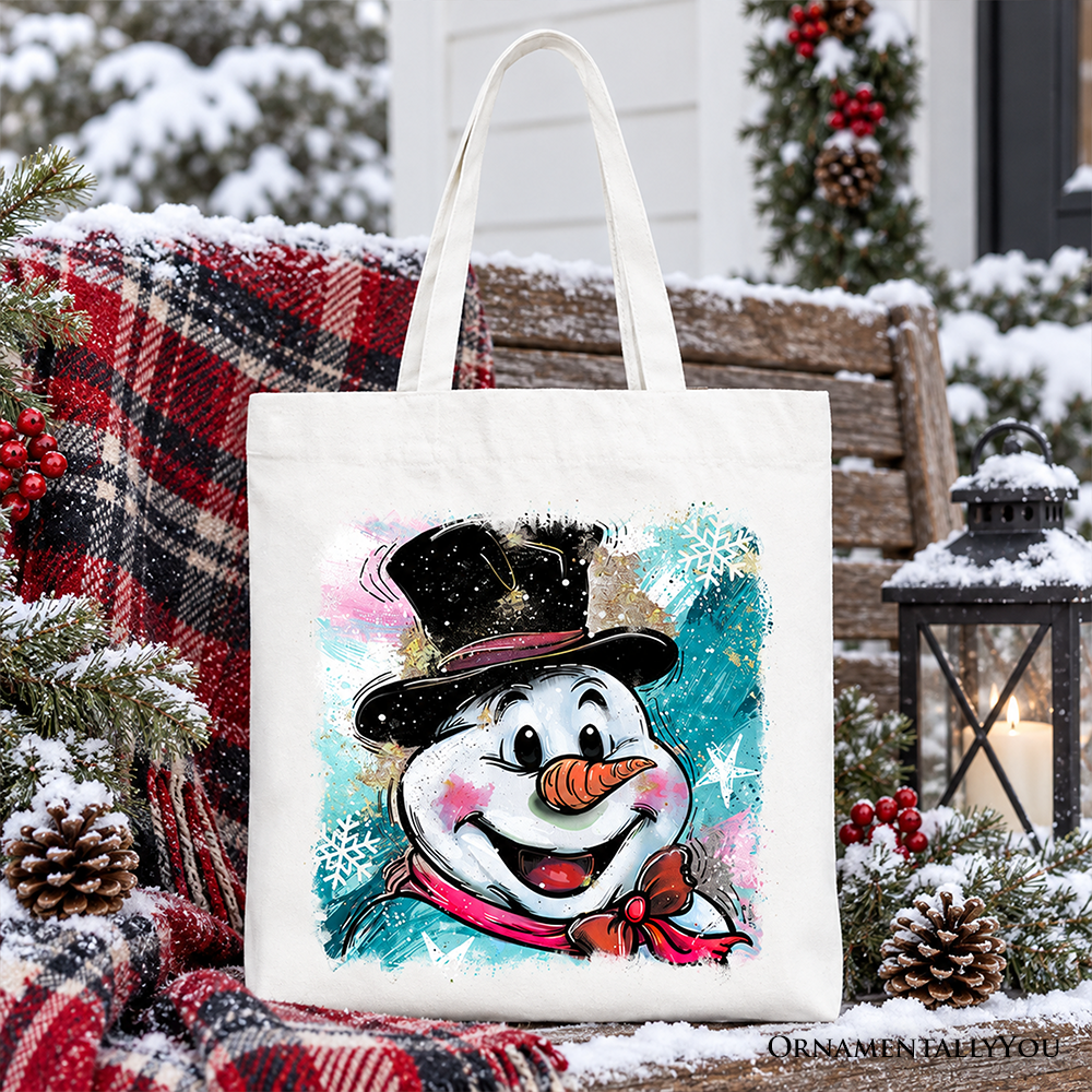 White cotton tote bag with navy handles and glitter-style snowman portrait print