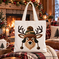 Beige canvas tote bag with embroidered deer head and antlers, light handles