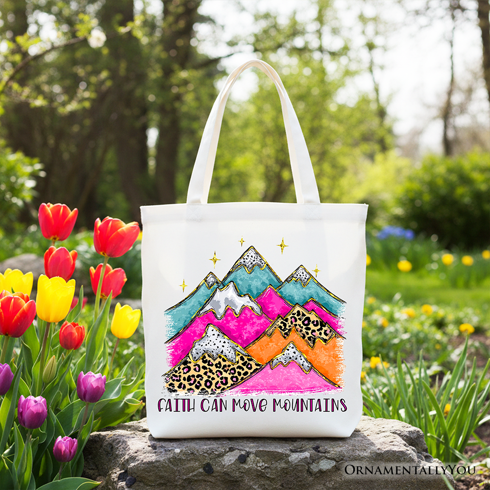 White tote bag with white handles, colorful mountain and leopard graphic with text