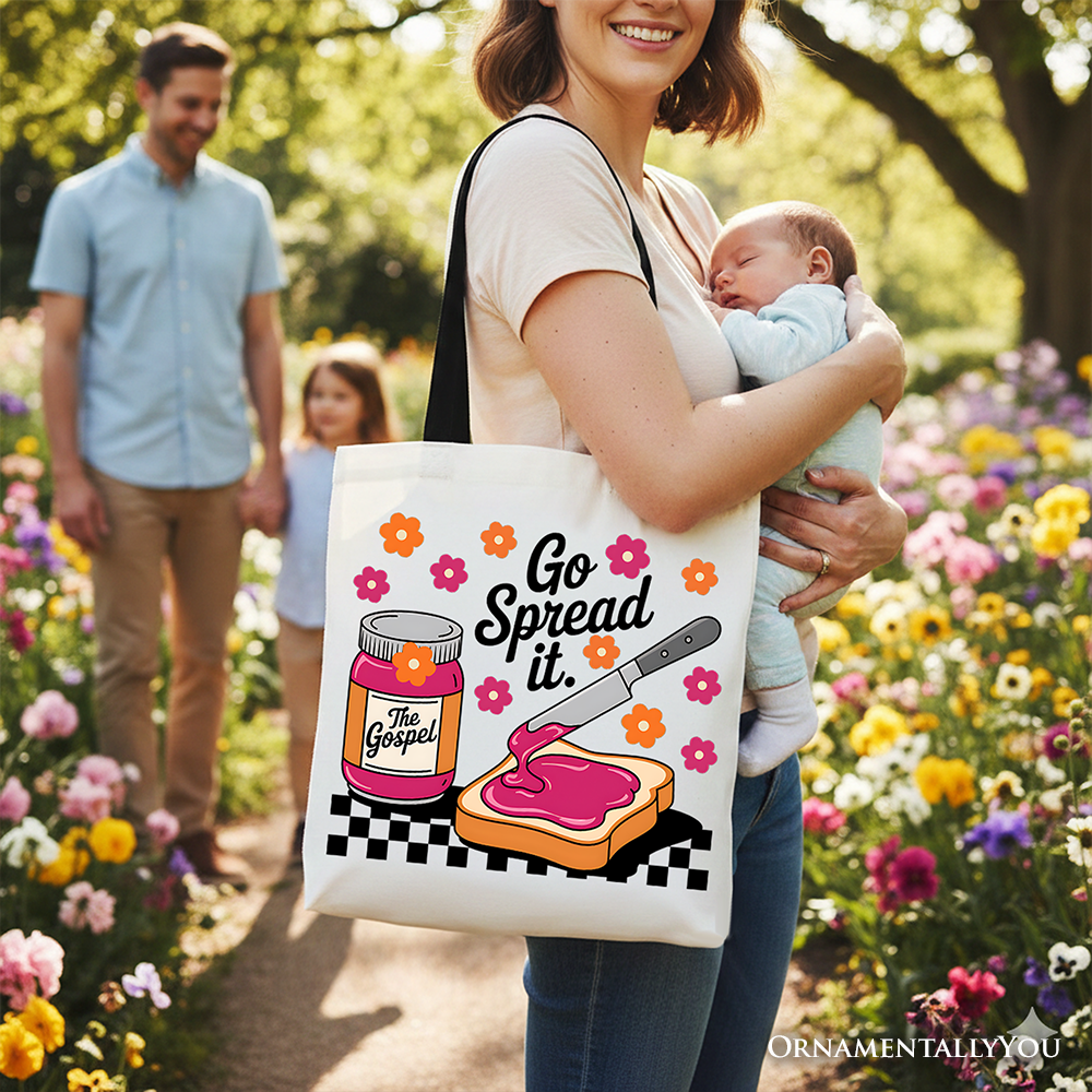 White tote bag with black handles and colorful 'Go Spread It' artwork
