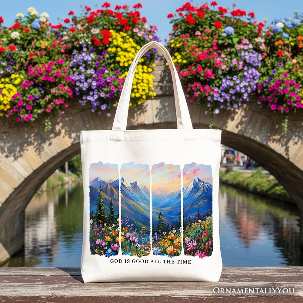 White canvas tote bag with white handles, mountain landscape bible verse print.