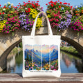 White canvas tote bag with white handles, mountain landscape bible verse print.