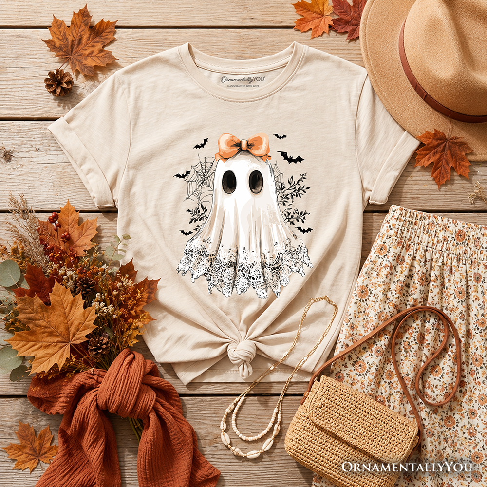 White kids T-shirt flat lay with ghost graphic, orange bow, short sleeves