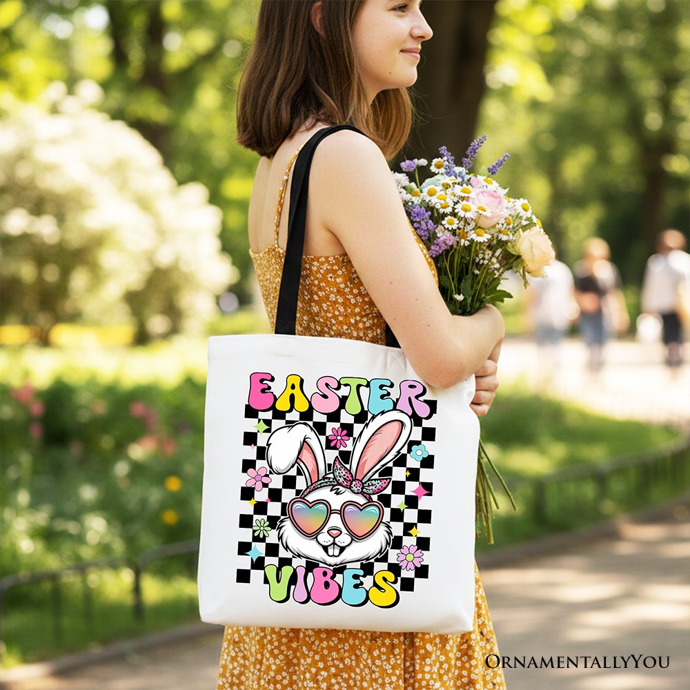 White cotton tote bag with black handles and 'Easter Vibes' bunny graphic.