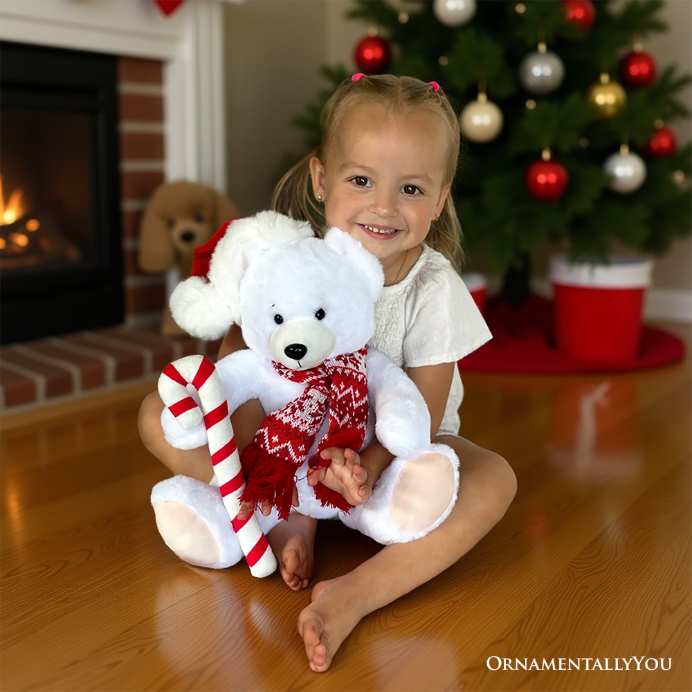 White polar bear plush in red patterned sweater with candy cane and Santa hat
