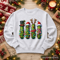 Ash crewneck sweatshirt laid flat, featuring festive pickle character graphic