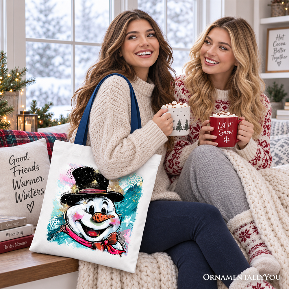 White cotton tote bag with navy handles, smiling snowman illustration with sparkles