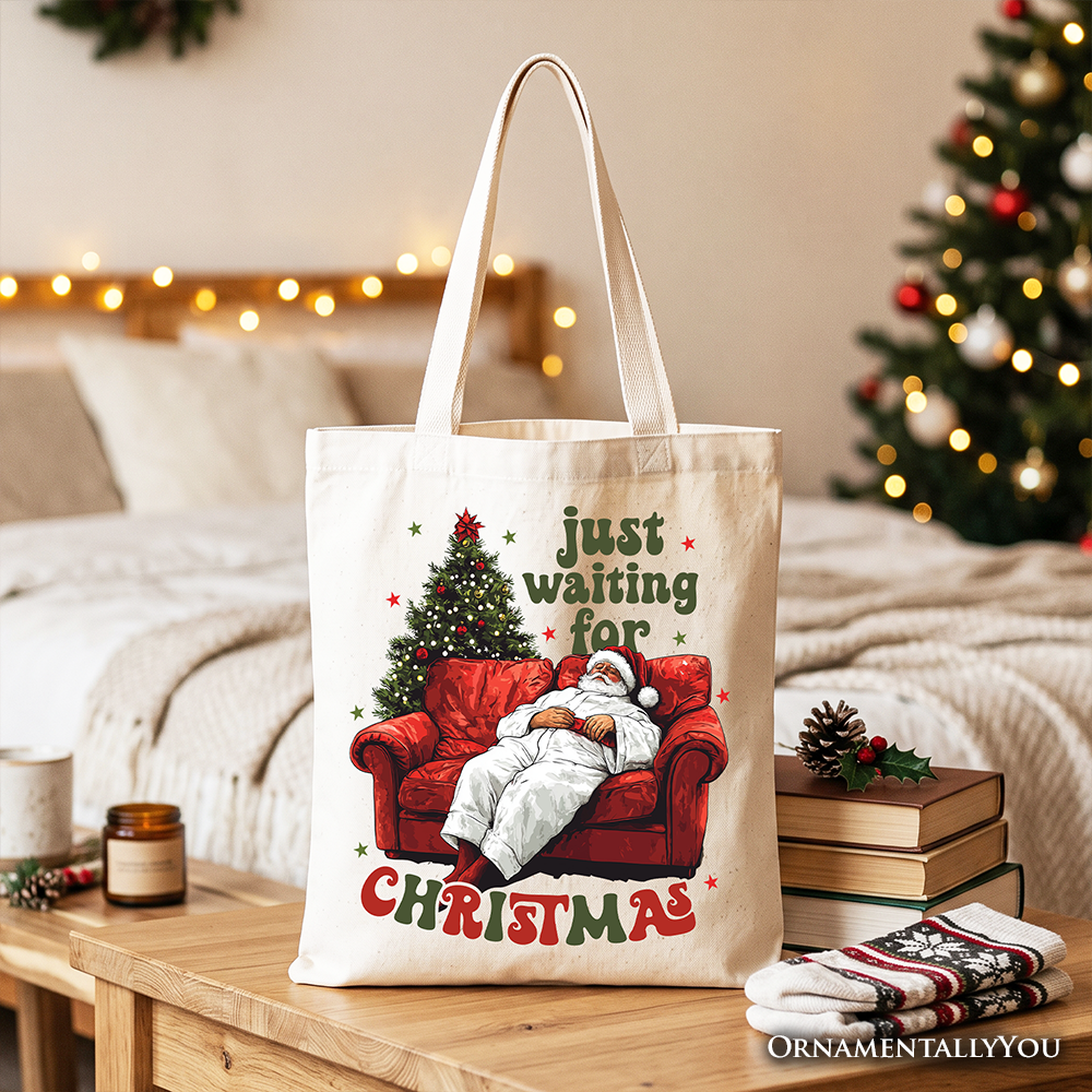 Cream tote bag with Santa-on-couch 'Just waiting for Christmas' print, wide open handles