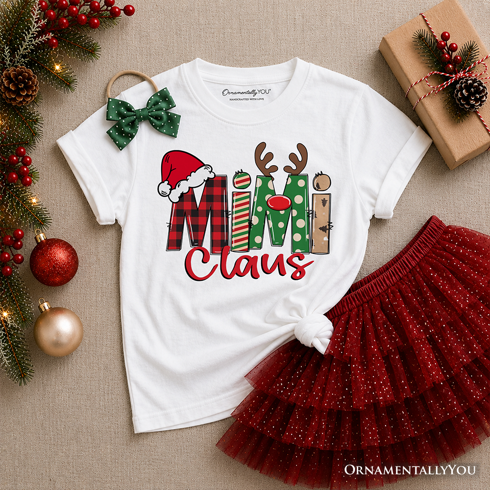 White kids T-shirt with Santa and Christmas block “Claus” graphic, folded for display