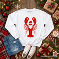 White long-sleeve sweatshirt with red lobster Santa graphic, laid flat