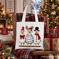 Christmas tote bag with three cartoon snowmen in festive red and black, beige handles