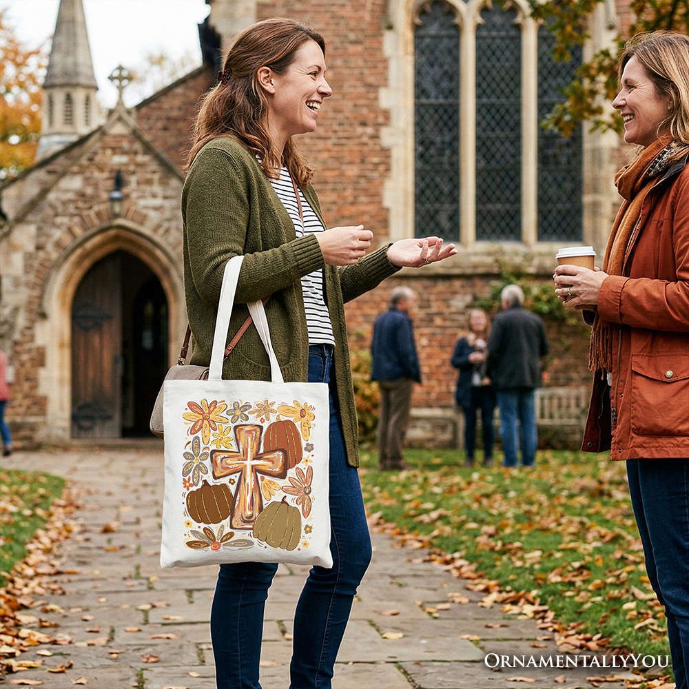 Cream tote bag with gold cross, pumpkins, and floral fall design