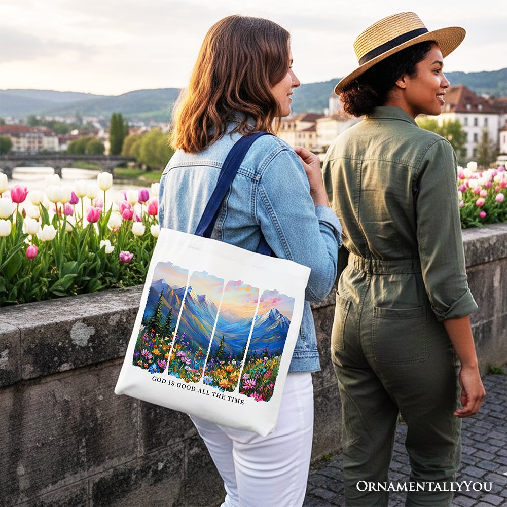 White canvas tote bag with blue handles, mountain landscape bible verse print.