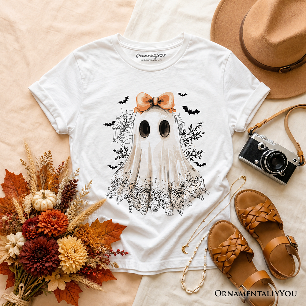 White kids T-shirt top view with ghost graphic, orange bow, short sleeves