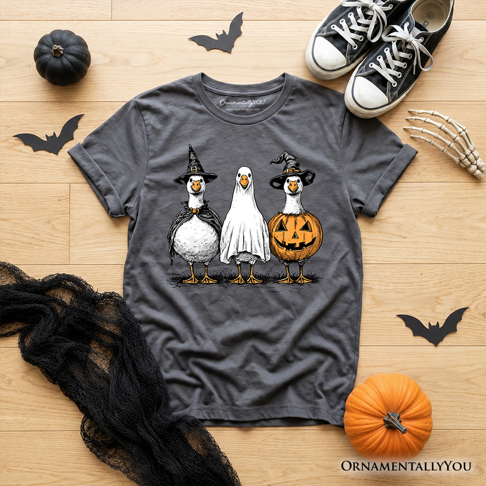 Kids dark gray Halloween T-shirt, flat lay with penguin trio graphic and jack-o-lantern