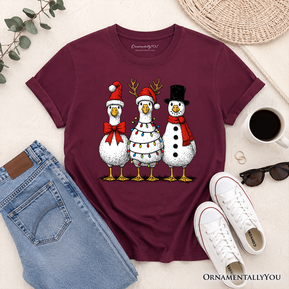 Kids maroon Christmas graphic T-shirt flat lay with three snowmen birds